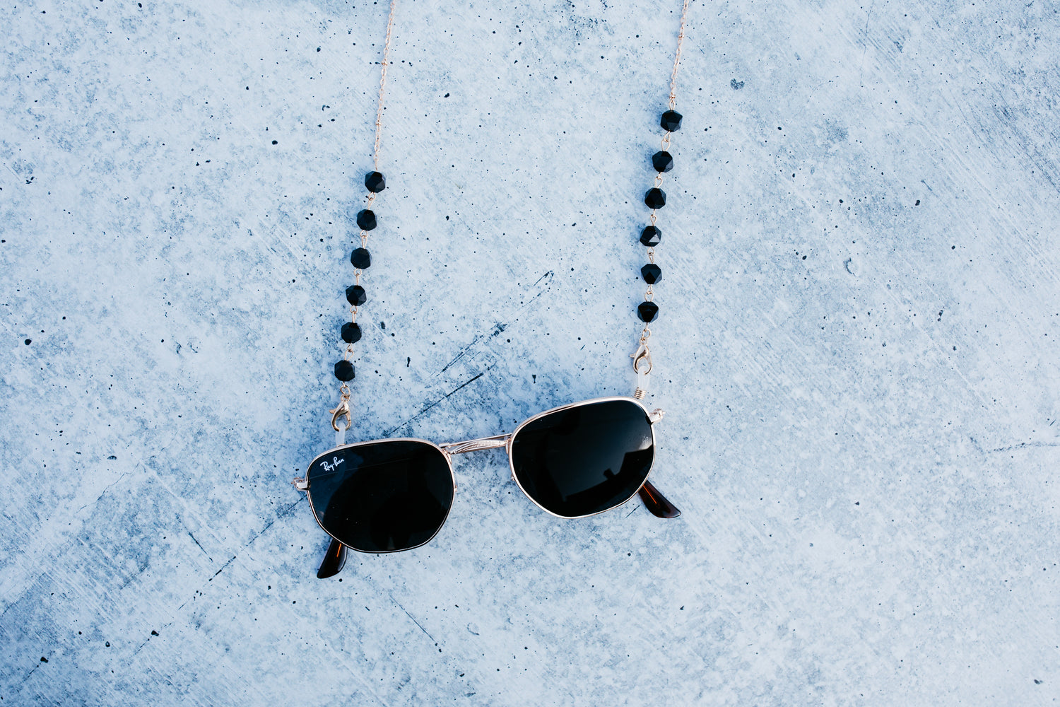 black and gold sunglasses chain